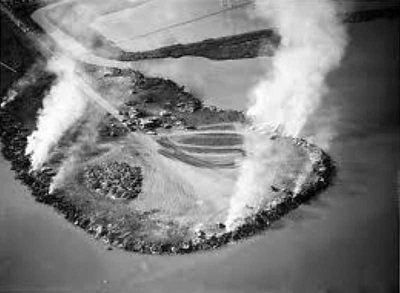 Aerial photo of Cooley Landing when it was the burning landfill of the San Mateo County Dump